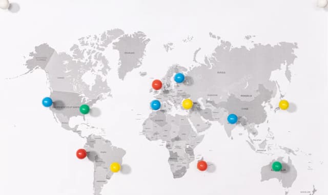 World map with pins indicating various locations